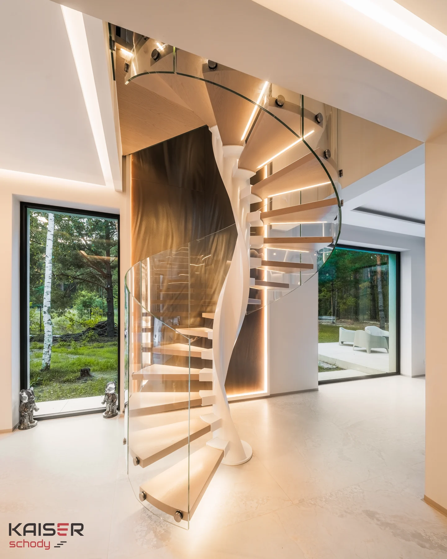 Light-coloured spiral staircase with a glass balustrade — view 02