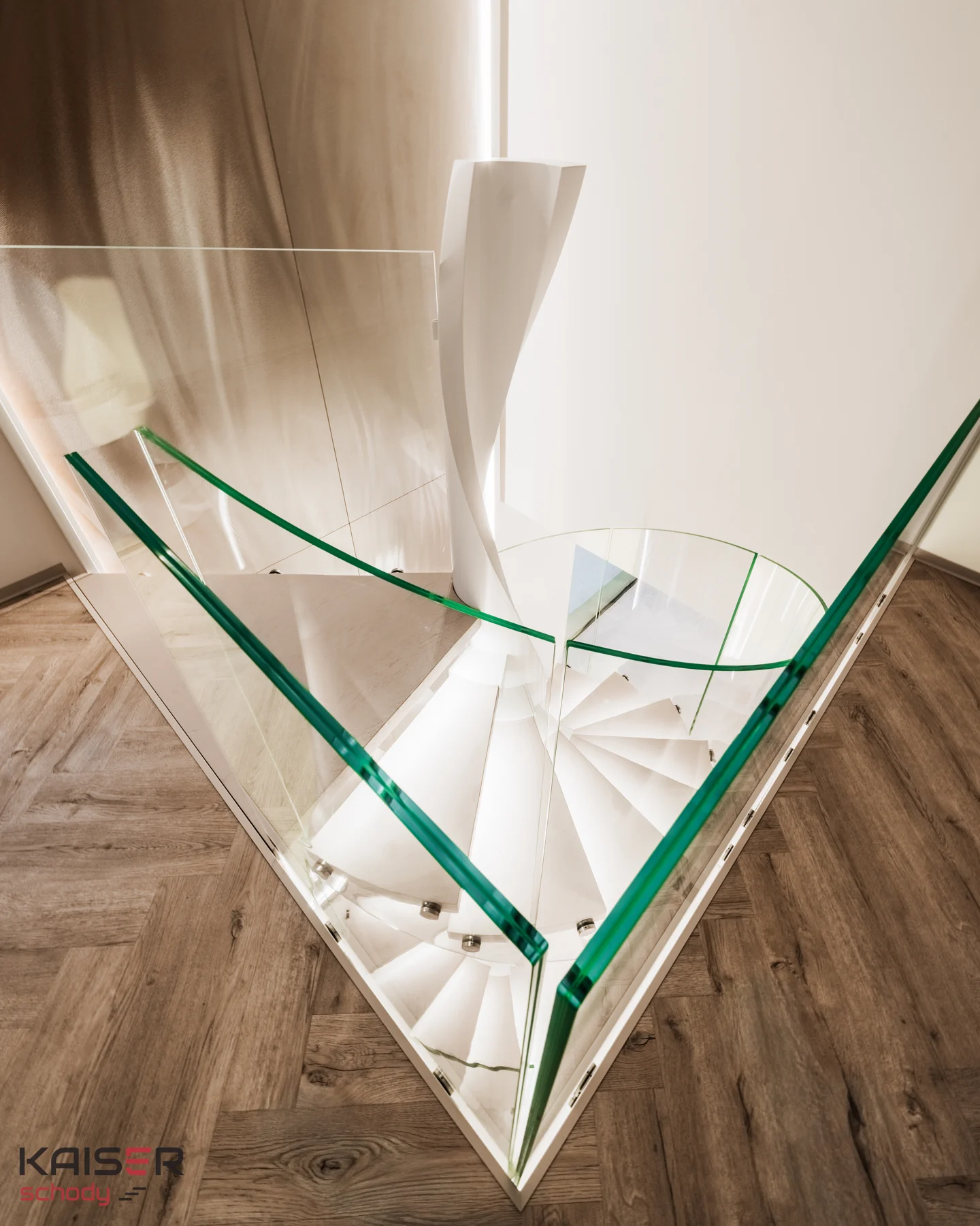 Light-coloured spiral staircase with a glass balustrade — view 04