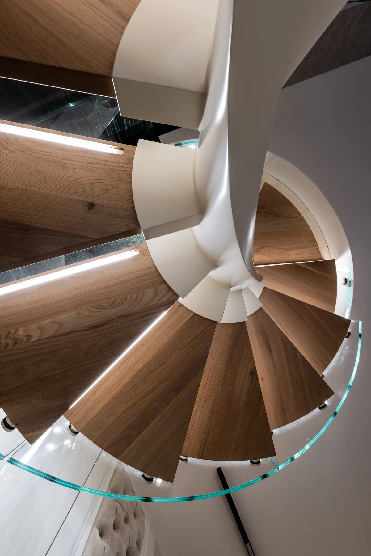 Spiral staircase with timber and curved glass — view 03